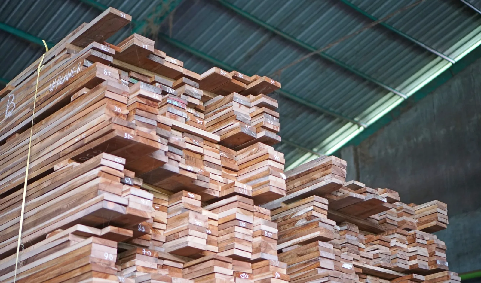 Stacks of selected solid timber stored in an Indonesian production facility