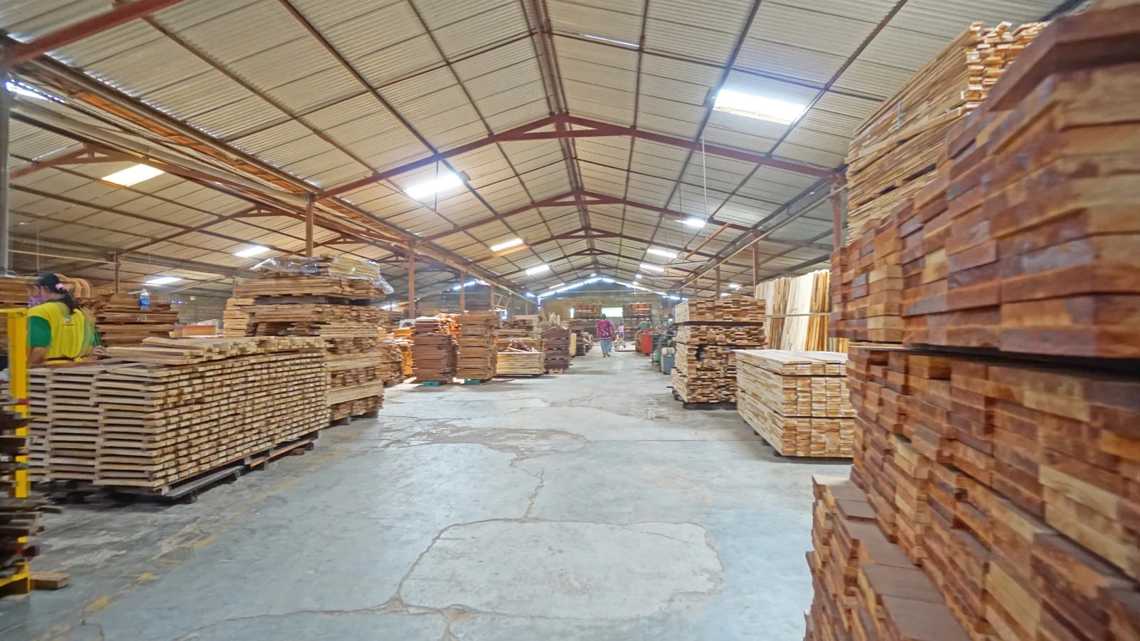 An organized wood production workshop with prepared components ready for processing